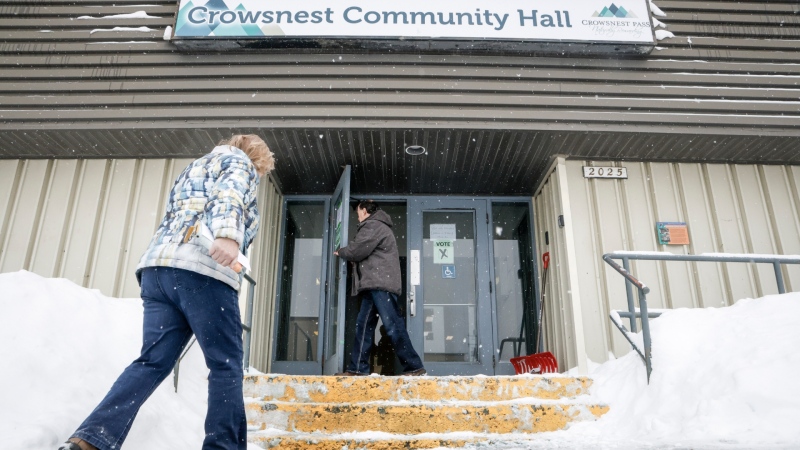 Residents enter a polling station to cast their votes in a plebiscite on whether to support a new coal mine in Crowsnest Pass, Alta., Monday, Nov. 25, 2024. (THE CANADIAN PRESS/Jeff McIntosh)