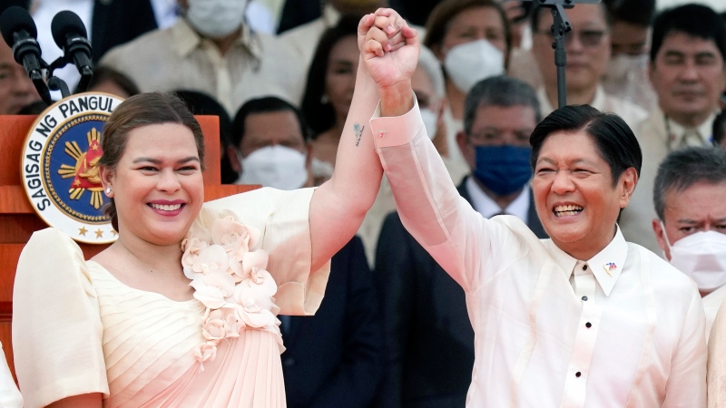 Philippine President Ferdinand Marcos Jr., centre right, and Vice President Sara Duterte raise hands during the inauguration ceremony at National Museum on Thursday, June 30, 2022 in Manila, Philippines. (AP Photo/Aaron Favila, File) 