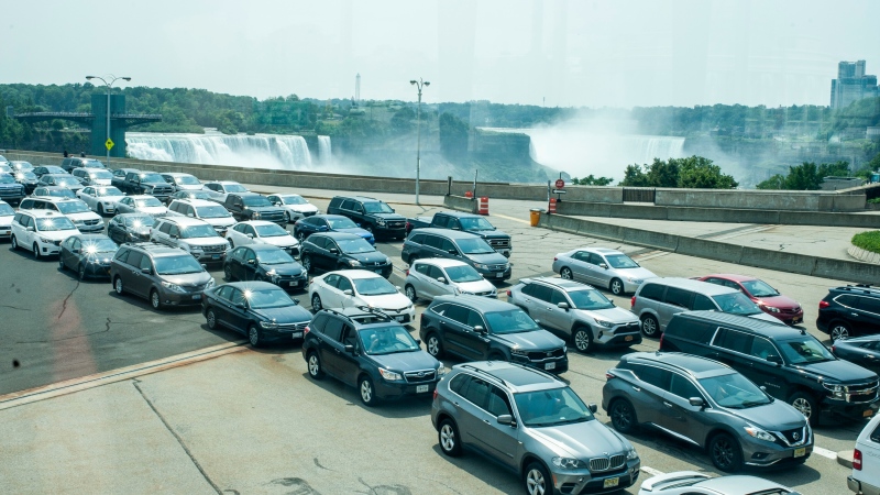 Cars wait on the Rainbow Bridge before crossing the border into Canada, in Niagara Falls, Ont. (Eduardo Lima / The Canadian Press)