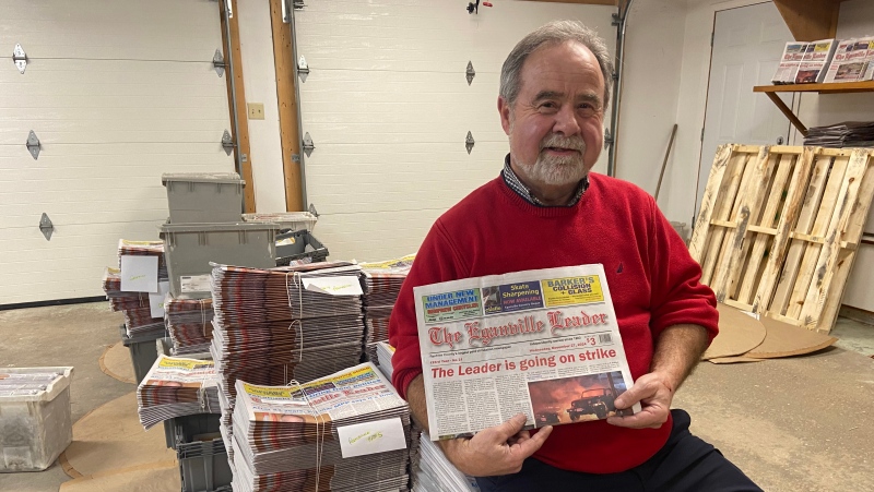 Eganville Leader publisher Gerald Tracey posing with the newspaper's last printed edition until the Canada Post strike ends. (Dylan Dyson/ CTV News Ottawa)