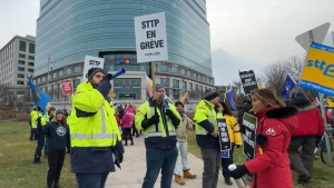 Striking postal workers deliver a message