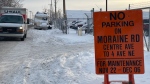 City of Calgary crews placed temporary “no parking” signs along Moraine Road NE Sunday, where several RV residents are living. (Photo credit: Darren Wright/CTV News)