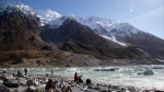 Tourists visit the frozen glacier lake at the foot of New Zealand's highest peak, Aoraki/Mount Cook, in the South Island of New Zealand, Monday, Aug. 17, 2020.  (AP Photo/Mark Baker)