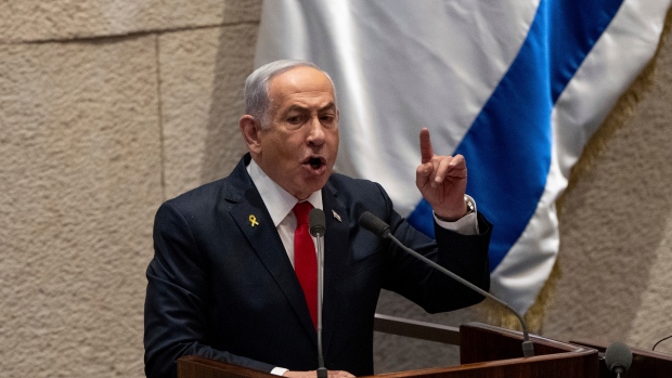 Israel's Prime Minister Benjamin Netanyahu addresses lawmakers in the Knesset, Israel's parliament, in Jerusalem. Monday Nov.18, 2024. (AP Photo/Ohad Zwigenberg) 