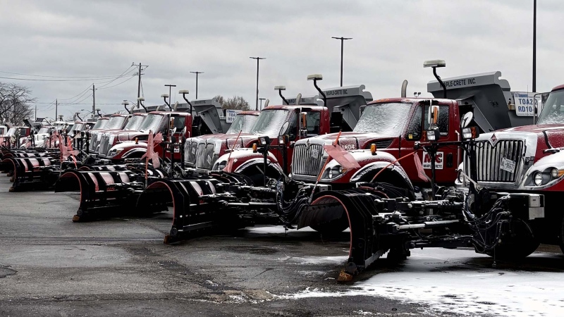 A line of snow plows stand at the ready as Environment Canada issues a winter travel advisory over Toronto on Wednesday Dec. 4, 2024. (CP24)