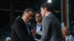 Nelson Chang, left, Chairman of TCC Group, E-One Moli Energy (Canada), shakes hands with Prime Minister Justin Trudeau after a news conference at the lithium battery manufacturer, in Maple Ridge, B.C., on Nov. 14, 2023. (THE CANADIAN PRESS/Darryl Dyck)