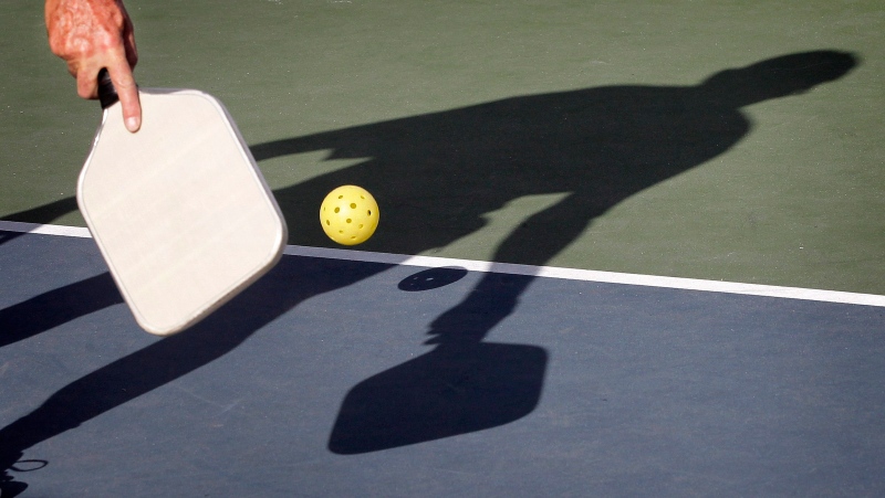 In this Monday, Dec. 3, 2012 photo, Del Teter competes in a game of pickleball at Sun City West senior community in Surprise, Ariz. (Source: AP Photo/Matt York)