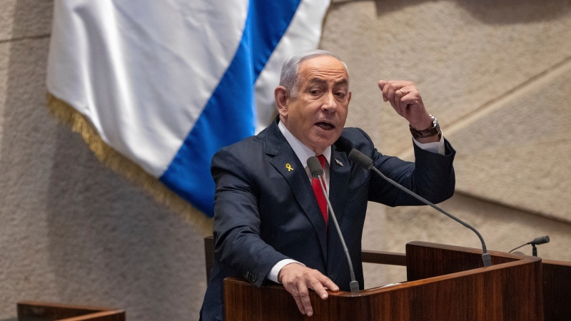 Israel's Prime Minister Benjamin Netanyahu addresses lawmakers in the Knesset, Israel's parliament, in Jerusalem. Monday Nov. 18, 2024. (AP Photo/Ohad Zwigenberg) 