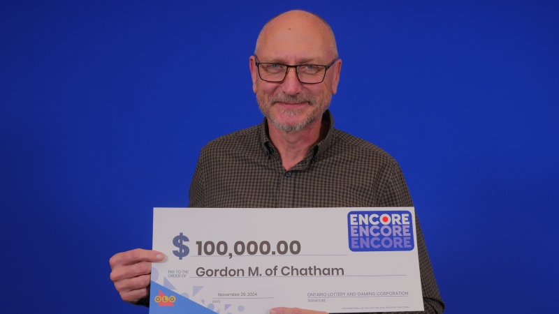 Gordon Milak of Chatham, Ont. shows off his winning cheque. (Source: OLG)