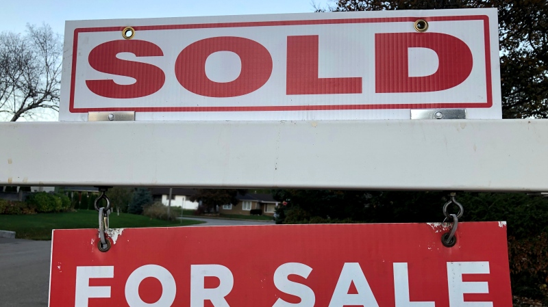 Real estate sale signage is shown on a street in Oakville, Ont., west of Toronto, on Thursday, Nov.7, 2024. (THE CANADIAN PRESS/Richard Buchan)