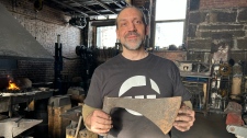 Montreal blacksmith Mathieu Collette said he has a 'little place in paradise' after he led a team of blacksmiths to forge axes used in the reconstruction of the Notre-Dame Cathedrale in Paris. (Swidda Rassy / CTV News)