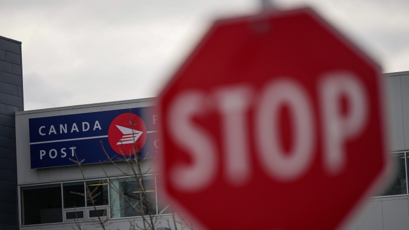 A Canada Post logo is seen on the outside of the Pacific Processing Centre, in Richmond, B.C., on Wednesday, November 27, 2024.  (THE CANADIAN PRESS/Darryl Dyck)