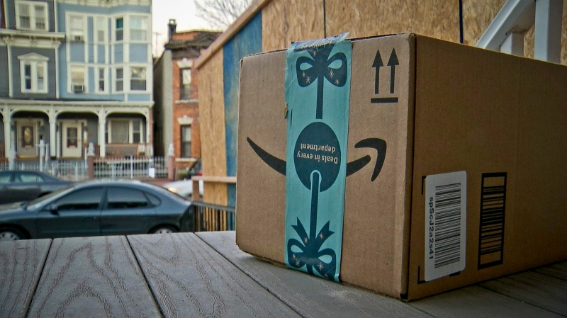 This image taken from video shows an Amazon package containing a GPS tracker on the porch of a Jersey City, N.J. residence after its delivery Tuesday, Dec. 11, 2018. (AP Photo/Robert Bumsted)