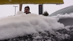 Trevor Ebert, salesperson at Leaven’s Chrysler in east London, has spent the past few days clearing cars of snow after the storm, seen on Dec. 7, 2024. (Brent Lale/CTV News London)