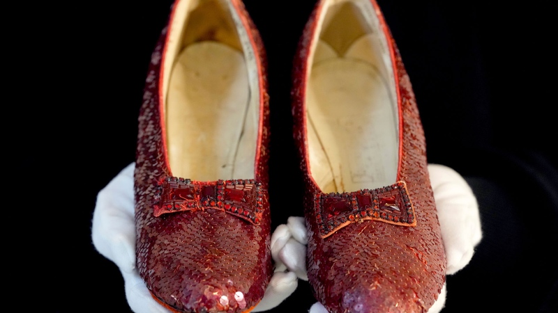 The original ruby slippers worn by Judy Garland in the classic 1939 film The Wizard of Oz are displayed in London ahead of being offered for auction on Dec. 7, at Heritage Auctions in the US, Wednesday, Nov. 27, 2024. (AP Photo/Kirsty Wigglesworth)
