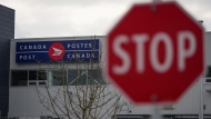 A Canada Post logo is seen on the outside of the Pacific Processing Centre in Richmond, B.C. on Wednesday, November 27, 2024. THE CANADIAN PRESS/Darryl Dyck