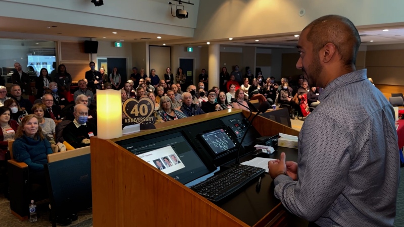 Everad Tilokee speaking to the crowd of transplant recipients at the Ottawa Heart Institute, Dec. 9, 2024, as part of 40th anniversary celebrations. (Dave Charbonneau/CTV News Ottawa)