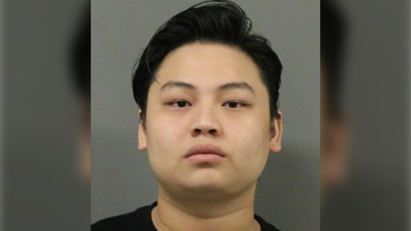 Shing Wai Wong was one of three people charged in October in connection to an alleged fraud ring that targeted individuals and businesses selling high-end vehicles in the Lower Mainland. (Richmond RCMP)