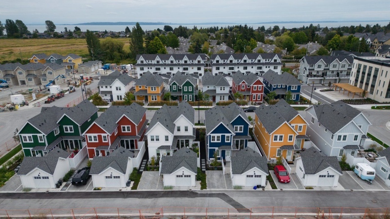 New single family houses billed as estate cottages and townhouses under construction are seen in an aerial view, in Delta, B.C., on Monday, Aug. 12, 2024. THE CANADIAN PRESS/Darryl Dyck