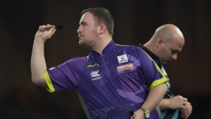 Luke Littler of England in action during the semifinal match against Scott Williams of England at the World Darts Championship, in London, Tuesday, Jan. 2, 2024. (AP Photo/Kin Cheung, File)