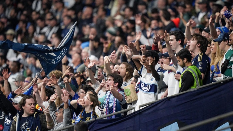 Vancouver Whitecaps fans cheer during the second half of a first-round MLS Cup playoffs soccer match against Los Angeles FC, in Vancouver, on Sunday, Nov. 3, 2024. (THE CANADIAN PRESS/Darryl Dyck)