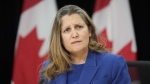 Deputy Prime Minister and Finance Minister Chrystia Freeland speaks with reporters in Ottawa on Tuesday, Dec. 10, 2024. Freeland says under Donald Trump as president, the United States has an open strategy of creating economic uncertainty in other countries to discourage investment outside U.S. borders. (THE CANADIAN PRESS/Adrian Wyld)