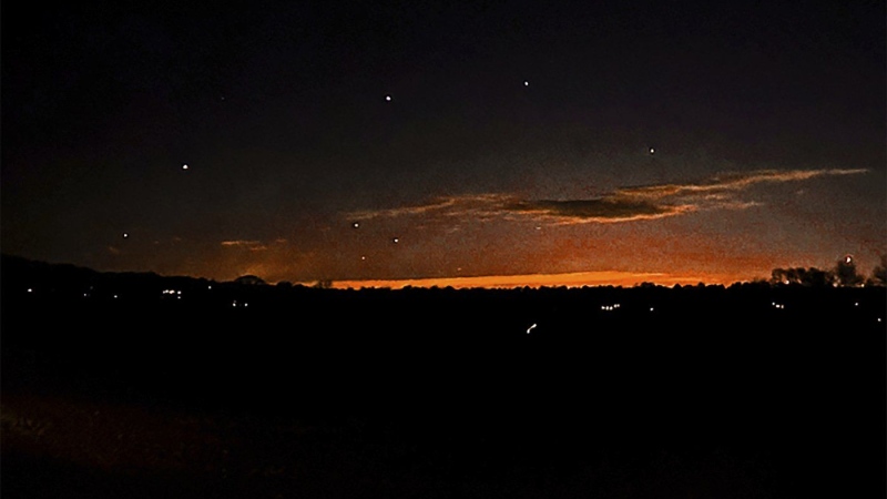 This photo provided by Trisha Bushey shows the evening sky and points of light near in Lebanon Township, N.J., on Thursday, Dec. 5, 2024. (Trisha Bushey via AP)