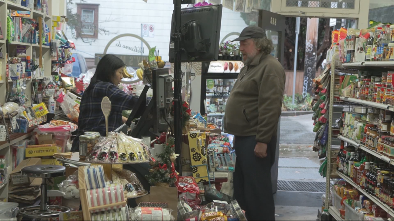 Janet Benedetti works behind the counter at Benny's Market. 