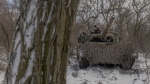 A Ukrainian crew member stands on a Leopard 1A5 tank near Pokrovsk in Ukraine's eastern Donetsk region on Dec. 13. (Roman Pilipey/AFP/Getty Images via CNN Newsource)