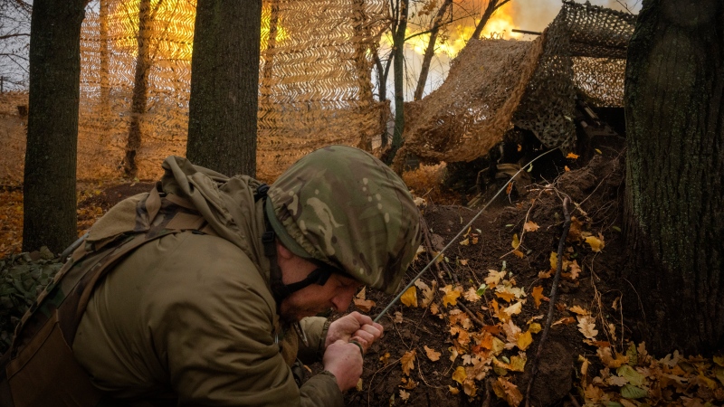 A serviceman of the 13th Brigade of the National Guard of Ukraine fires Giatsint-B gun towards Russian positions near Kharkiv, Ukraine, on Nov. 6, 2024. (AP Photo/Efrem Lukatsky)
