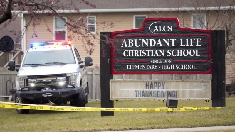 Emergency vehicles are parked outside the Abundant Life Christian School in Madison, Wis., following a shooting, Monday, Dec. 16, 2024. (AP Photo/Morry Gash)