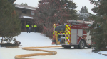 Crews on the scene of a fire on Varsity Crescent N.W. on Dec. 16, 2024. (CTV News) 