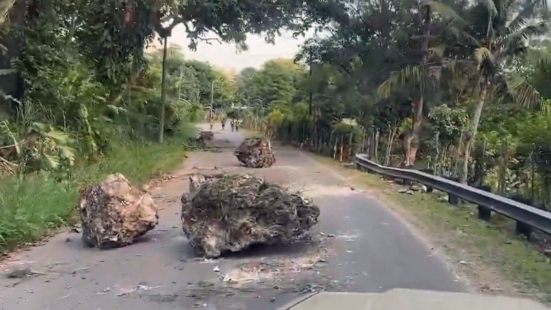 Rocky debris left across road after quake