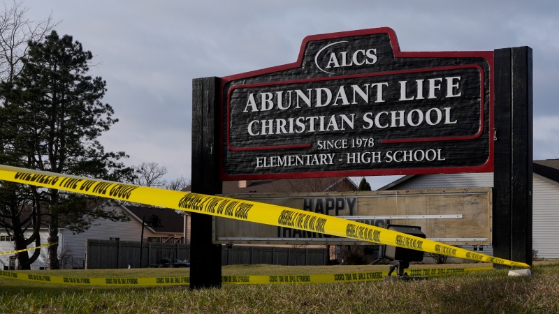 Police tape is seen outside the Abundant Life Christian School Tuesday, Dec. 17, 2024 in Madison, Wis., following a shooting on Monday. (AP Photo/Morry Gash)