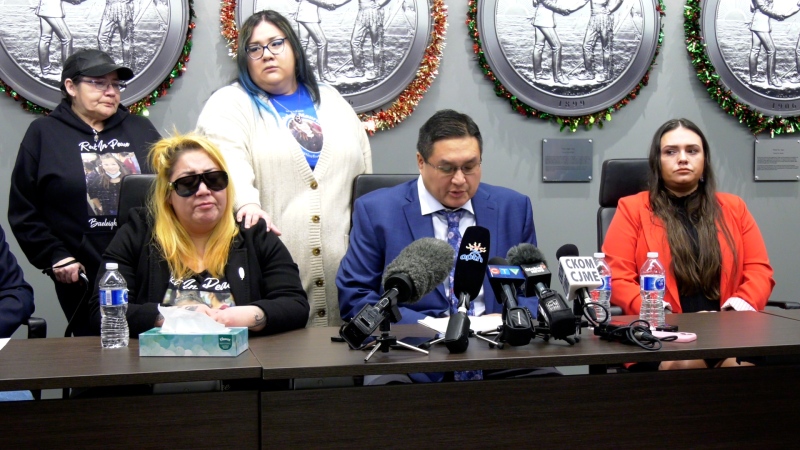 Fabian Head, the FSIN Third Vice Chief, sits beside Baeleigh Maurice’s mother during a press conference on Dec. 17, calling for changes to the justice system. (Dale Cooper/CTV News)