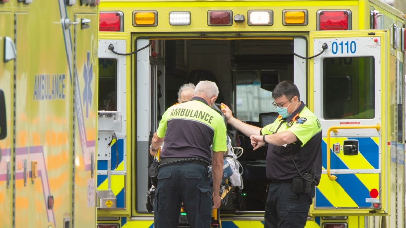 Urgences-santé workers transport a patient to Verdun hospital during the first day of the strike, Monday, June 14, 2021 in Montreal. (The Canadian Press/Ryan Remiorz)