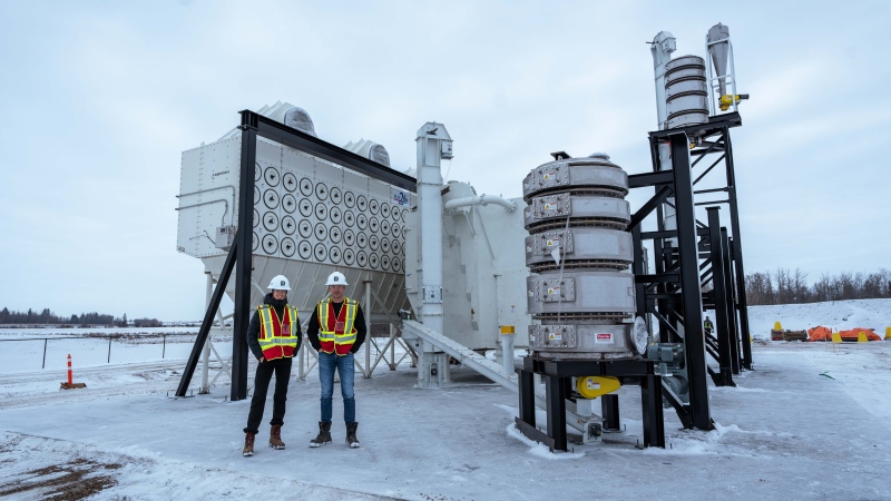 Damien Steel, right, Deep Sky CEO and Isabelle Callaghan, Deep Sky Project Manager, are seen posing for a photo at Deep Sky's direct air capture test facility, which is currently under construction, in Innisfail, Alta., in a 2024 handout photo. THE CANADIAN PRESS/HO-Deep Sky