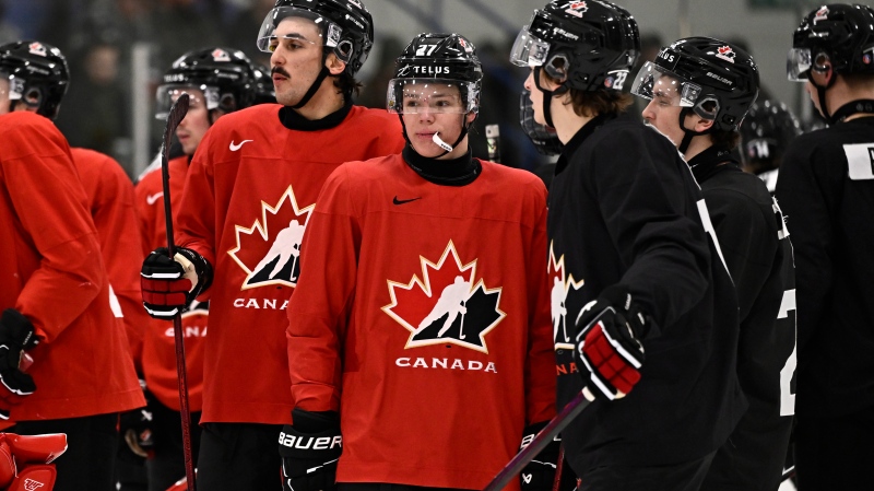 Team Canada's Easton Cowan (27) of Mount Brydges, Ont. looks on during practice at Silver Dart Arena on Canadian Forces Base (CFB) Petawawa, in Petawawa, Ont., Tuesday, Dec. 17, 2024. (Justin Tang/THE CANADIAN PRESS)