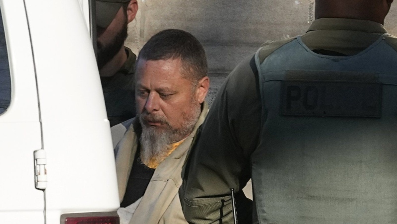 Officers escort Richard Allen out of the Carroll County Courthouse following a hearing, Nov. 22, 2022, in Delphi, Ind. (AP Photo/Darron Cummings, File)