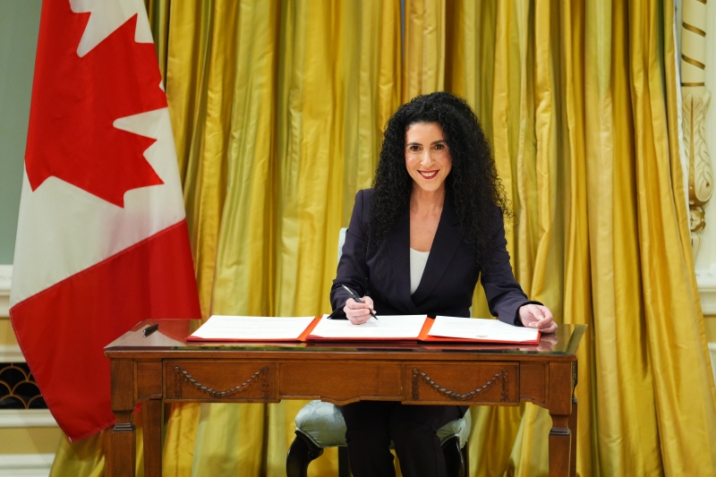 The Minister for Official Languages and Associate Minister of Public Safety, Rachel Bendayan, signs a document during a cabinet swearing-in ceremony at Rideau Hall in Ottawa, Friday Dec. 20, 2024. (The Canadian Press/Sean Kilpatrick)