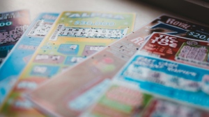 Several scratch-off lottery cards are spread out over a table in this undated stock image. (Erik Mclean/Pexels.com)