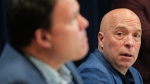 Montreal Canadiens general manager Kent Hughes, right looks over at executive vice president Jeff Gorton as they speak to the media during their end of season news conference in Brossard, Que., on Wednesday April 17, 2024. (Christinne Muschi/The Canadian Press)