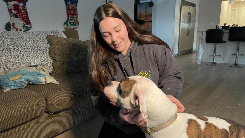 Kristan Tuffin shows her long-lost puppy some love, Dec. 21, 2024. (Hannah Schmidt/CTV News)