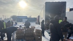 Volunteers from the Guru Nanak Free Kitchen in Regina unloading food for those in need. The organization, courtesy of Regina's Sikh community, has been providing food to those in need for the past seven years. (Hallee Mandryk/CTV News)