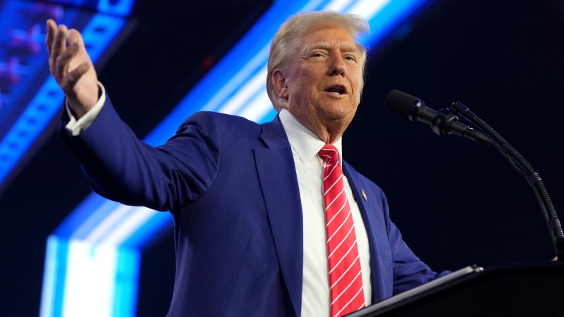 President-elect Donald Trump speaks at AmericaFest, Sunday, Dec. 22, 2024, in Phoenix. (AP Photo/Rick Scuteri)