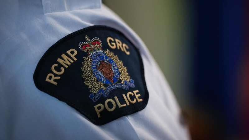 An RCMP patch is seen on the shoulder of Assistant Commissioner Brian Edwards, Officer in Charge of the Surrey RCMP, during a news conference, in Surrey, B.C., on Friday, April 28, 2023. (THE CANADIAN PRESS/Darryl Dyck)