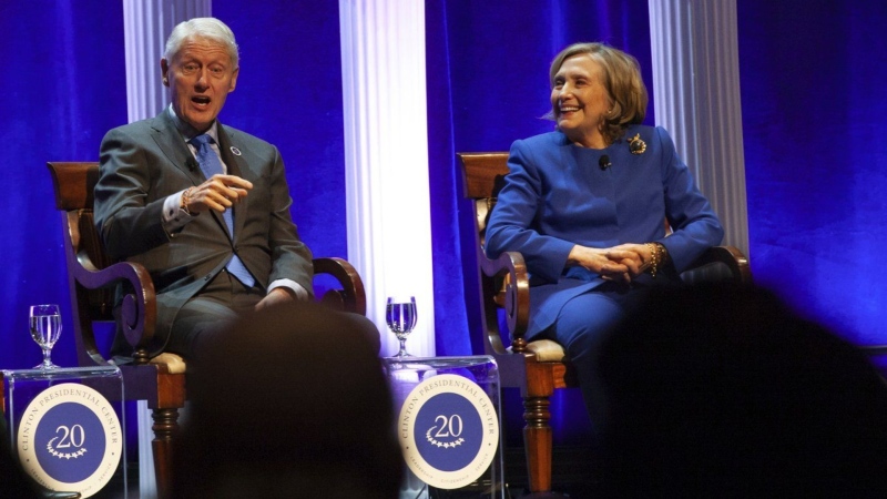 Former President Bill Clinton and former Secretary of State Hillary Rodham Clinton respond to audience questions on Saturday, Dec. 7, 2024 at the Robinson Center auditorum in Little Rock, Ark. (AP Photo/Katie Adkins)