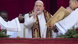 Pope Francis delivers the Urbi et Orbi (Latin for 'to the city and to the world' ) Christmas' day blessing from the main balcony of St. Peter's Basilica at the Vatican, Wednesday, Dec. 25, 2024. (Andrew Medichini/AP Photo)