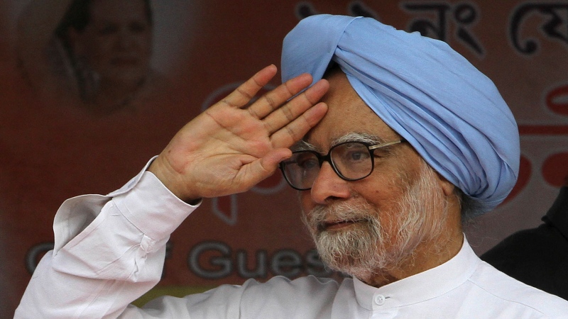 Indian Prime Minister Manmohan Singh greets the crowd during an election campaign rally at Khumtai, in the northeastern Indian state of Assam, March 29, 2014. (AP Photo/Anupam Nath, File)