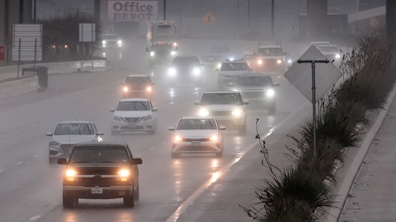 Vehicles make their way on a rain-soaked highway in Dallas, Dec. 26, 2024. (AP Photo/LM Otero)